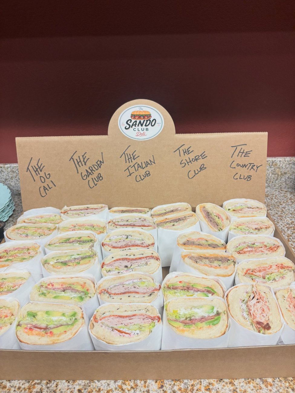 A Sando Club catering box of signature sandos